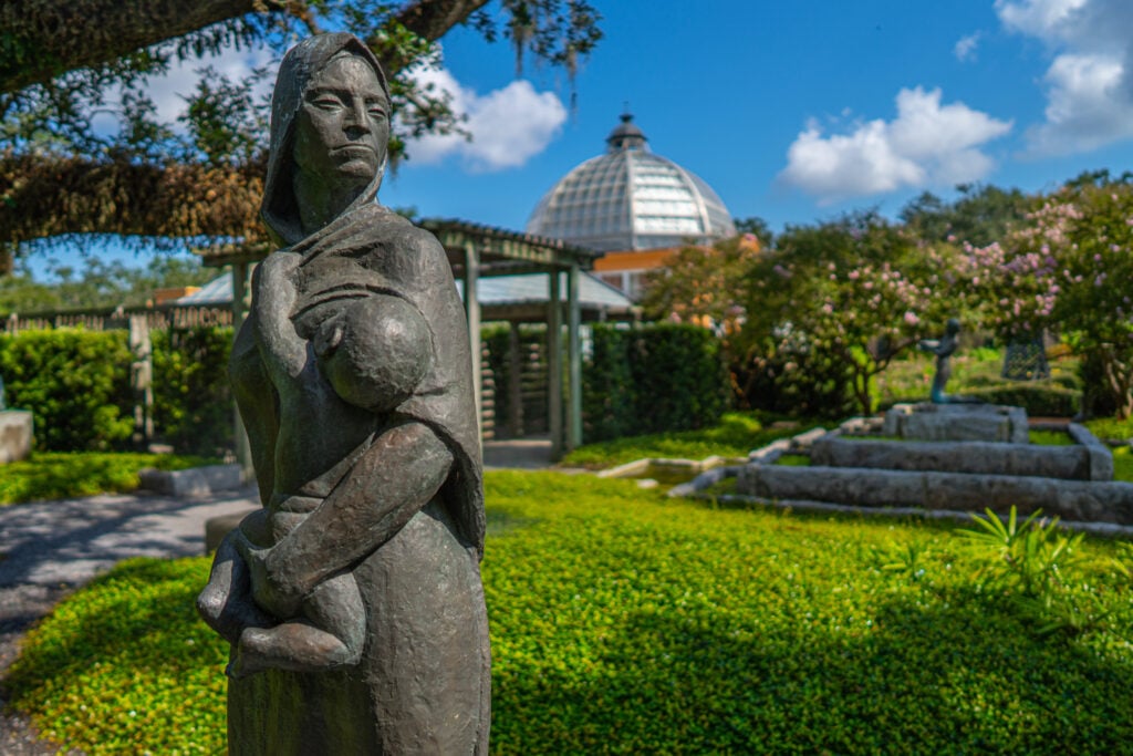 20 Must-Try Foods and Activities in New Orleans 14 A tranquil scene from the New Orleans Sculpture Garden, featuring a variety of artistic sculptures elegantly positioned among natural landscapes.
