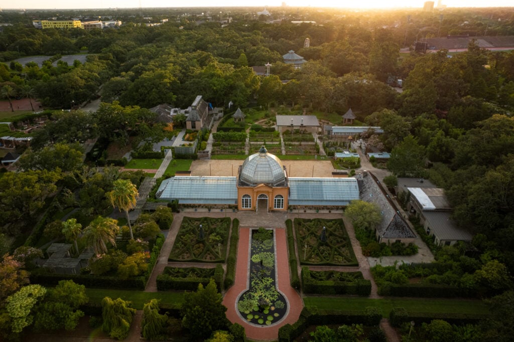 20 Must-Try Foods and Activities in New Orleans 15 Aerial view of the New Orleans Botanical Garden in City Park, showcasing a lush, meticulously maintained landscape.