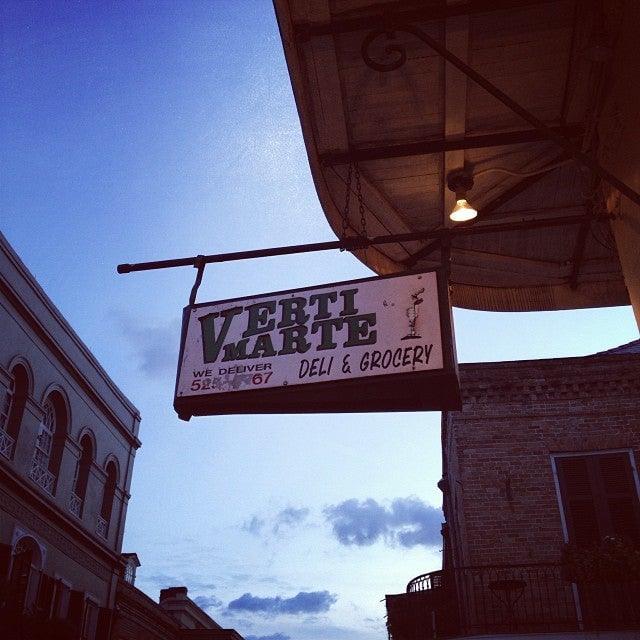 20 Must-Try Foods and Activities in New Orleans 5 The sign is framed with vintage-style gold and white trim, lending a classic and somewhat whimsical charm to the facade.