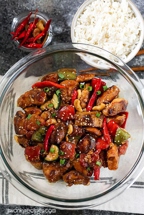 Kung Pao Chicken is a Chinese classic made with chicken breasts, chili peppers and fresh vegetables in a spicy sweet sauce with nuts. Serve with cooked rice for a quick homemade Chinese dinner that will rival any takeout recipe.