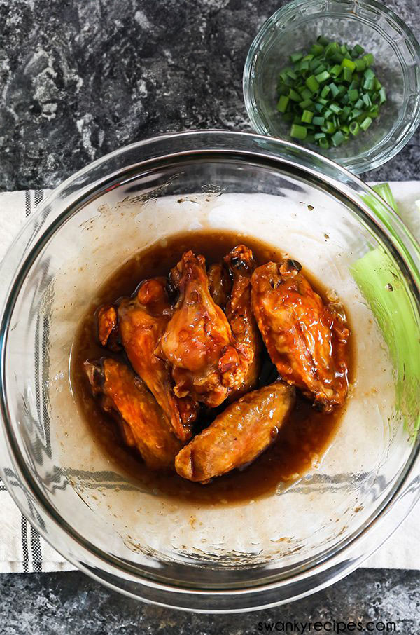 Easy Apricot BBQ Chicken Wings 2 Tossing wings in apricot barbeque sauce.
