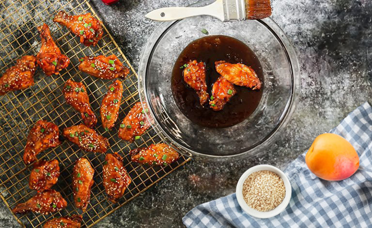 Easy Apricot BBQ Chicken Wings 4 Apricot barbeque wings coated with sauce.